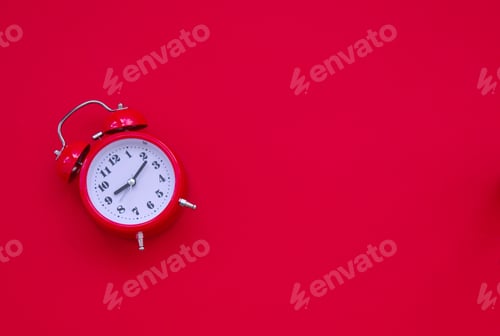 Preview: Red vintage alarm clock against red background
