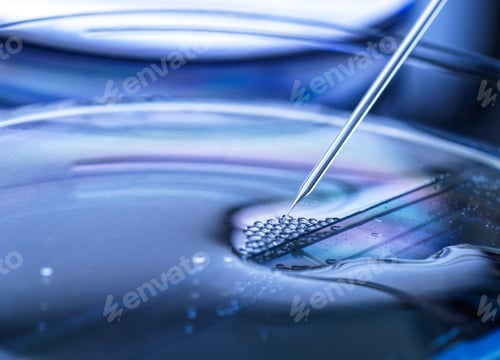 Preview: Closeup of pipette dropping liquid onto a surface, creating ripples and bubbles.