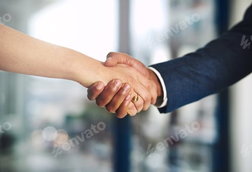 Preview: Cropped shot of a businessman and businesswoman shaking hands at work