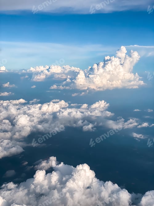 Preview: The airplane flew over the clouds.