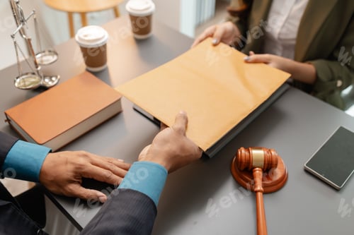 Preview: A lawyer and a client exchange a brown envelope across a desk