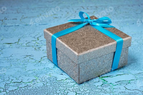 Preview: Gift box with blue ribbon