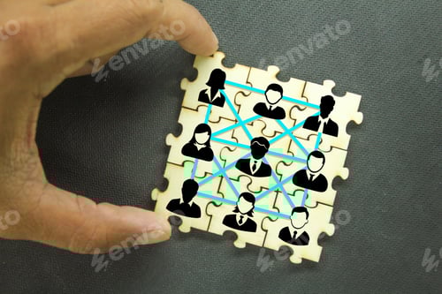 Preview: Puzzles with icons of a group of team workers. the concept of group relationships