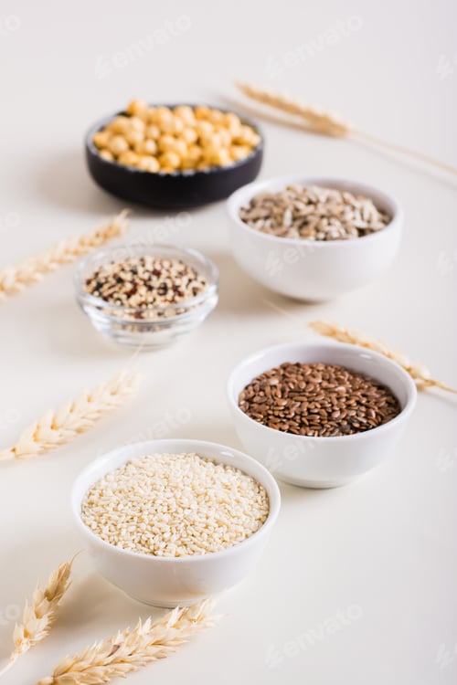 Preview: Sesame, flax seeds, quinoa, sunflower seeds and chickpeas in bowls. Healthy food. Vertical view