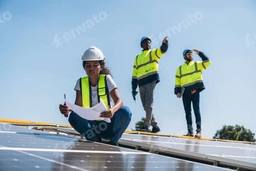 Preview: Service engineer checking solar cell on the roof. Clean energy concept.