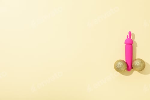 Preview: Sex toy with New Year's decor on a light background.