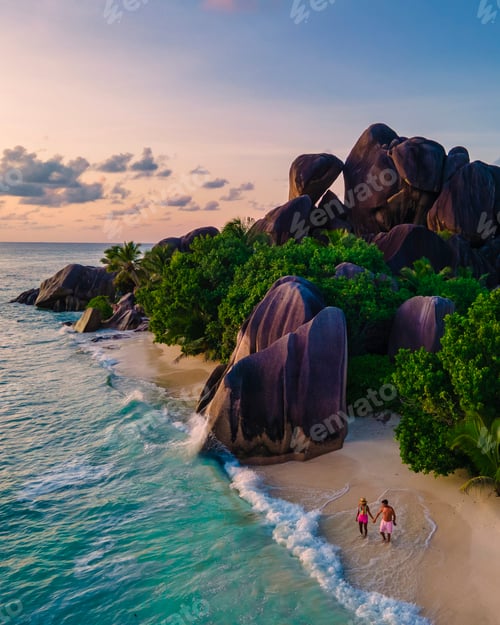 Preview: Anse Source d'Argent, La Digue Seychelles, young couple men and woman on a tropical beach