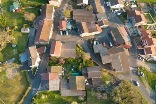 Preview: Aerial view of residential houses in green suburban rural area