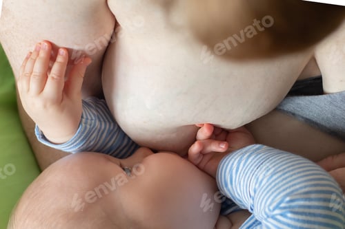 Preview: Caucasian mother breastfeeding a baby boy