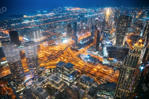 Preview: City background of illuminated cityscape with skyscrapers and modern urban architecture in Dubai