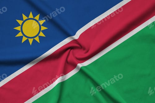 Preview: Namibia flag is depicted on a sports cloth fabric with many folds. Sport team waving banner