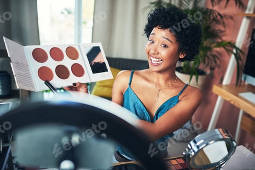 Preview: Shot of a influencer recording a makeup tutorial for her blog at home