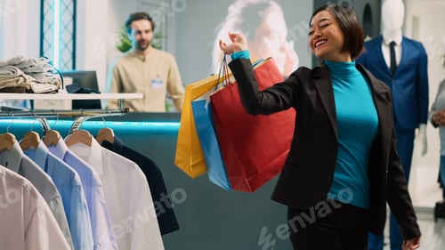 Preview: Asian woman showing dance moves feeling happy