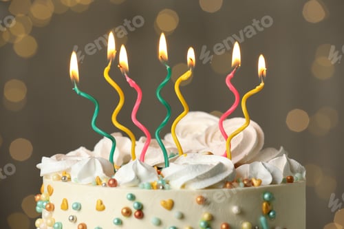 Preview: Beautiful birthday cake with burning candles on blurred background, closeup