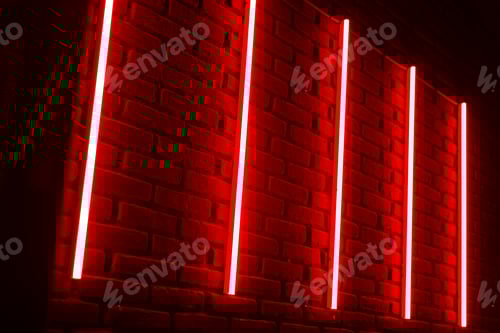 Preview: Red neon lines on brick wall in night club.
