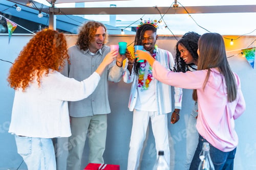 Preview: Multi-ethnic friends toasting during party in a terrace