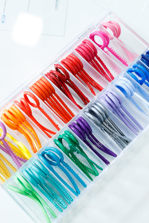 Preview: Colored elastic orthodontic bands for braces. Dentistry. Orthodontic treatment of teeth.