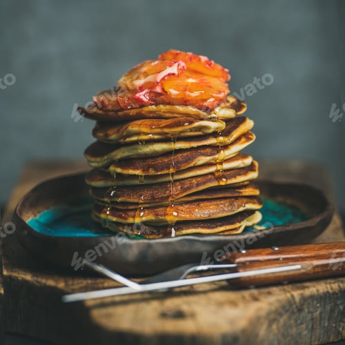 Preview: Homemade pancakes with honey and bloody orange slices, square crop