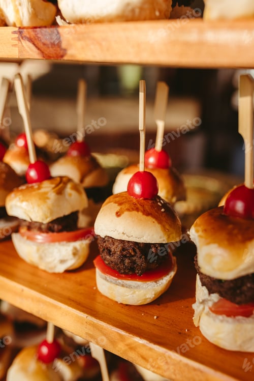 Preview: Miniature Burgers Arranged on Wooden Tray for Catering