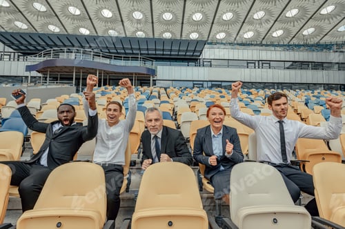 Preview: Excited people in business suits sitting in fan zone of stadium
