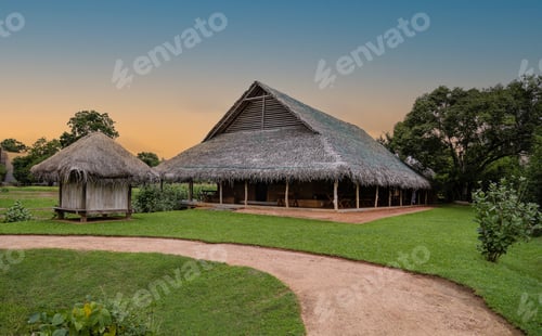 Preview: View cottages with thatch roofs in the countryside