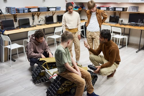 Preview: Teacher explaining the work of robotic machine to students
