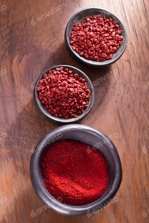 Preview: achiote in bowl on wooden background, achiote paste