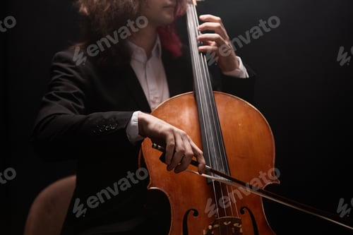Preview: Cellist Performing Music with Violoncello in Black Suit