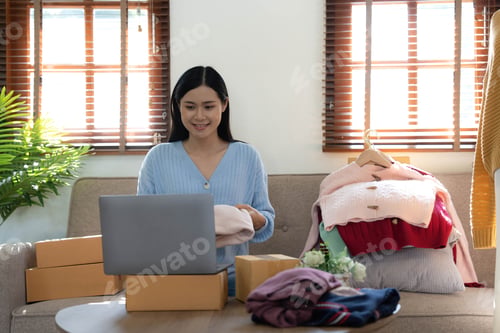 Preview: Startup small business entrepreneur SME, asian woman packing box. Portrait of young Asian small busi