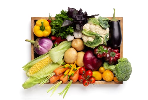 Preview: Fresh organic vegetables in wooden box on white