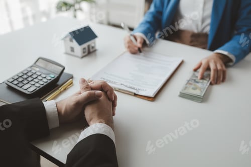 Preview: Loan Officers Closing a Deal at a Desk