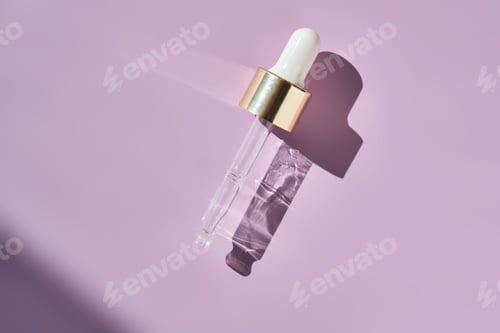 Preview: A serum pipette on a lilac background.