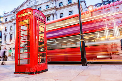 Preview: London red telephone booth and red bus in motion