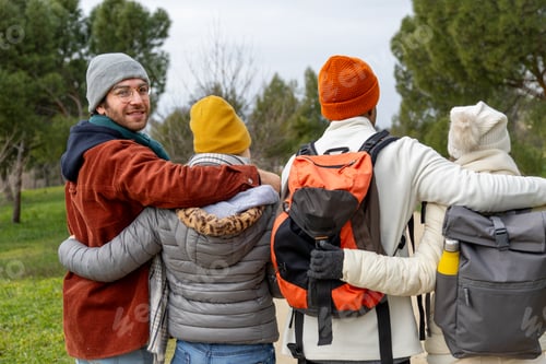 Preview: Hikers walking together in the woods, embracing friendship and nature
