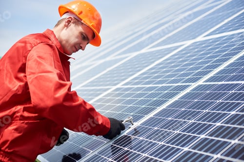 Preview: Technician is installing solar cell to save energy against the blue sky