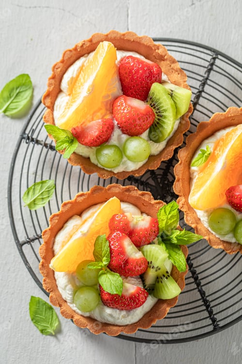 Preview: Homemade mini tart with various fruits. Sweet fruit dessert.