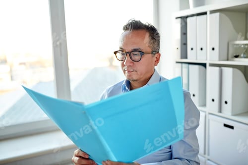Preview: businessman with folder and papers at office