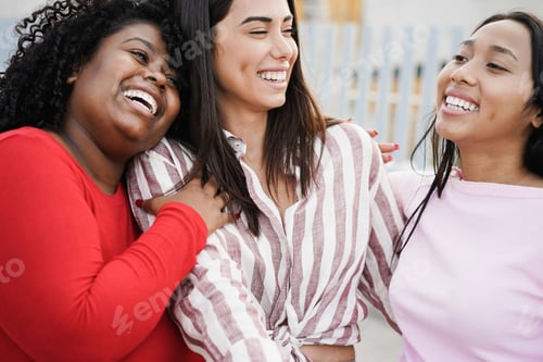 Preview: Happy latin girls enjoy time together outdoor around city - Focus on african girl face