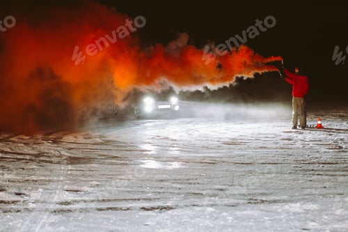 Preview: men ride at night in an SUV with orange smoke