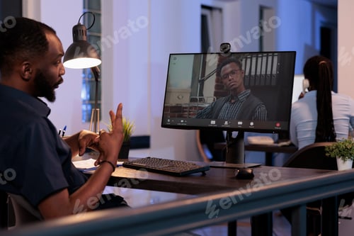 Preview: Office worker meeting with man on remote teleconference chat