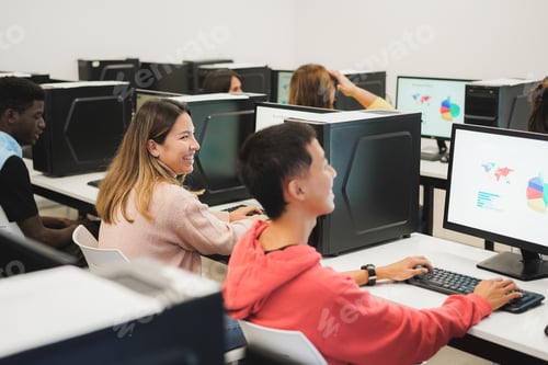 Preview: Young students using computers during business class at school - Focus on center girl face
