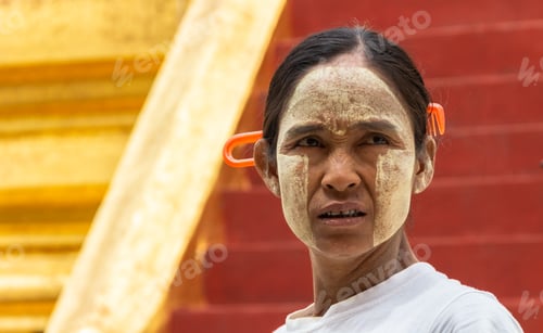 Preview: Bagan, Myanmar - June, 25 2012: Ethnic woman with painted face