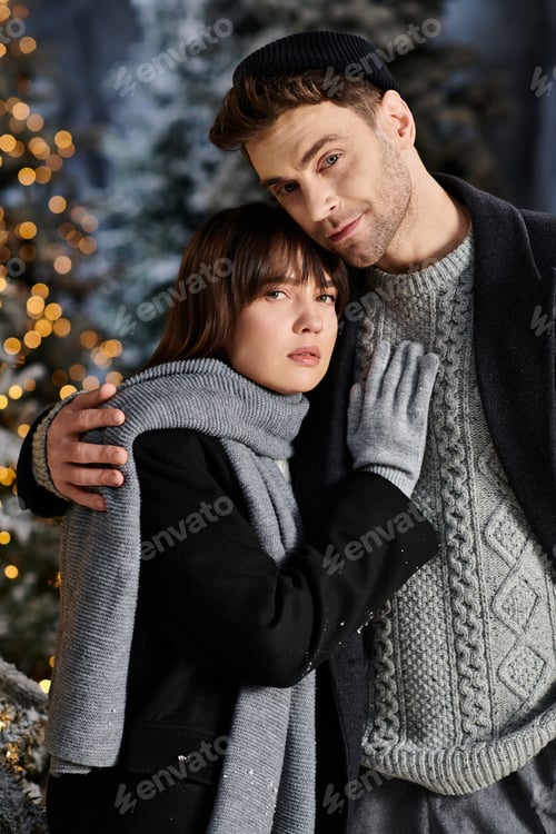 Preview: A cozy couple embraced in winter near snow-covered pine trees celebrating the holiday season