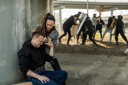 Preview: Girl assissting protester to stop bleeding