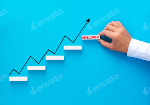 Preview: Businessman hand arranging wood block stacking as step stair with growth arrow. Business growth succ