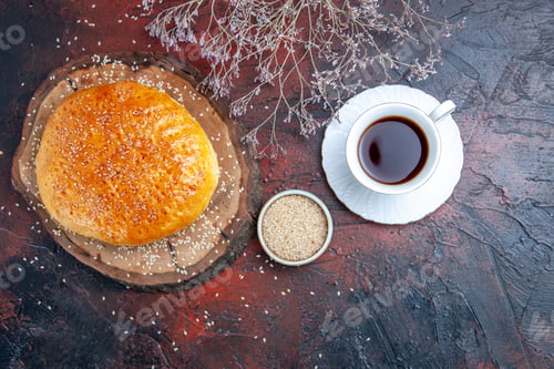 Preview: top view sweet baked bun with cup of tea on dark background dough bread cake pie
