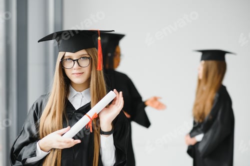 Preview: Educational theme: graduating student girl in an academic gown.