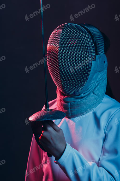 Preview: Fencer woman with fencing sword. Fencers duel concept.