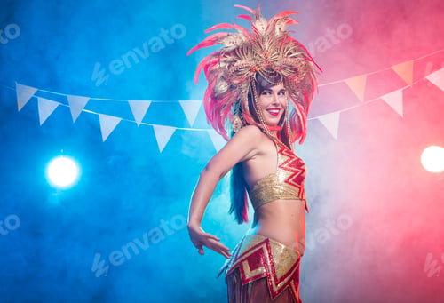 Preview: Carnival, belly dance and holiday concept - Beautiful female samba dancer wearing gold costume and