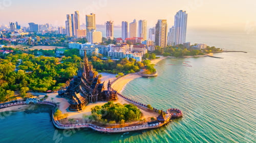 Preview: Sanctuary of Truth, Pattaya, Thailand, wooden temple by the ocean at sunset on the beach of Pattaya